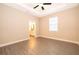 Spacious main bedroom with hardwood floors and ensuite bathroom access at 7848 Somersworth Dr, Kissimmee, FL 34747