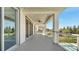 Spacious covered balcony with ceiling fans and neighborhood views at 7921 Jacks Club Dr, Kissimmee, FL 34747
