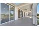 Large, covered balcony with ceiling fan and sliding glass doors for indoor-outdoor living at 7921 Jacks Club Dr, Kissimmee, FL 34747
