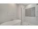 Modern bathroom featuring a standalone tub, glass shower, and stylish finishes at 7921 Jacks Club Dr, Kissimmee, FL 34747