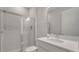 Bathroom featuring sleek vanity, walk-in shower with stylish light fixtures at 7921 Jacks Club Dr, Kissimmee, FL 34747