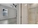Bright en-suite bathroom with glass-enclosed shower and views into the bedroom at 7921 Jacks Club Dr, Kissimmee, FL 34747