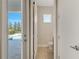 Bathroom with exterior access to the pool area at 7921 Jacks Club Dr, Kissimmee, FL 34747