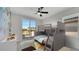 Stylized bedroom with bunk beds, a colorful rug, and a balcony with a view at 7921 Jacks Club Dr, Kissimmee, FL 34747
