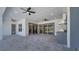 Spacious covered patio with outdoor kitchen, ceiling fans and access to the backyard pool area at 7921 Jacks Club Dr, Kissimmee, FL 34747