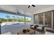 Covered patio with ceiling fans overlooking a pool and spa, surrounded by tropical landscaping at 7921 Jacks Club Dr, Kissimmee, FL 34747