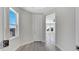 Bright hallway showcases a modern design with connecting rooms and plenty of natural light at 7921 Jacks Club Dr, Kissimmee, FL 34747