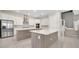Modern kitchen with white cabinets, stainless appliances, and kitchen island at 7921 Jacks Club Dr, Kissimmee, FL 34747