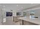 A gourmet kitchen featuring a large island, stainless steel appliances, and a view into the living area at 7921 Jacks Club Dr, Kissimmee, FL 34747