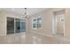 A well-lit living room leads to the outdoor area through the sliding doors at 7921 Jacks Club Dr, Kissimmee, FL 34747