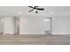 Spacious loft with recessed lighting, gray flooring and multiple doorway entries at 7921 Jacks Club Dr, Kissimmee, FL 34747