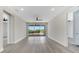 Spacious loft with recessed lighting, gray flooring, and a large outdoor balcony at 7921 Jacks Club Dr, Kissimmee, FL 34747