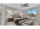 Bedroom features a king bed, and a balcony with a view at 7921 Jacks Club Dr, Kissimmee, FL 34747