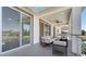 Outdoor patio featuring modern furniture and sliding glass doors at 7921 Jacks Club Dr, Kissimmee, FL 34747