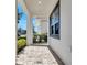 Inviting covered porch with a brick paver floor, perfect for enjoying the outdoors at 7921 Jacks Club Dr, Kissimmee, FL 34747