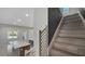View of the open floor plan showing staircase, living room and kitchen island at 7921 Jacks Club Dr, Kissimmee, FL 34747