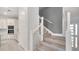 Bright entryway featuring a modern staircase with stainless steel railings and natural light at 7921 Jacks Club Dr, Kissimmee, FL 34747