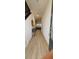 Inviting entryway featuring wood-look tile flooring, decor, and a glimpse into the living area at 803 Longboat Dr, Davenport, FL 33896