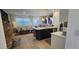 Open living space with an island, stainless steel appliances, and neutral-toned decor at 803 Longboat Dr, Davenport, FL 33896