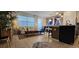 Bright living area with a stylish decor, hardwood floors, an island, and natural light at 803 Longboat Dr, Davenport, FL 33896