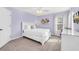 Charming bedroom with lilac walls, soft carpet and white furnishings at 8462 Secret Key Cv, Kissimmee, FL 34747