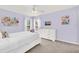 Cozy bedroom with lavender walls, soft carpet, and a large white dresser at 8462 Secret Key Cv, Kissimmee, FL 34747