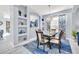 Elegant dining room with modern chandelier and open view to the living area at 8462 Secret Key Cv, Kissimmee, FL 34747