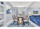 Elegant dining room with modern chandelier and open view to the living area at 8462 Secret Key Cv, Kissimmee, FL 34747