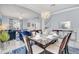 Bright dining room with an elegant table setting, chandelier, and open floor plan at 8462 Secret Key Cv, Kissimmee, FL 34747