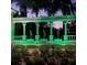 Emerald Island Resort illuminated entrance at dusk showcasing manicured landscaping and a welcoming ambiance at 8462 Secret Key Cv, Kissimmee, FL 34747