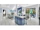 Open-concept layout with a combined living and dining area, featuring modern decor and pool views at 8462 Secret Key Cv, Kissimmee, FL 34747