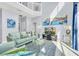 Bright living room with comfortable seating, a glass coffee table, and artwork enhancing the decor at 8462 Secret Key Cv, Kissimmee, FL 34747