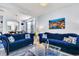 Bright living room with open layout and views to the dining area and kitchen at 8462 Secret Key Cv, Kissimmee, FL 34747