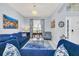 Comfortable living room with blue furniture and decor, and a light and airy feel at 8462 Secret Key Cv, Kissimmee, FL 34747