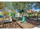 Outdoor playground with slides and climbing equipment, perfect for to enjoy in a safe and engaging environment at 8462 Secret Key Cv, Kissimmee, FL 34747