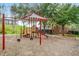 Outdoor playground with swings, slide, and climbing structure, perfect for Gathering fun in a well-maintained community park at 8462 Secret Key Cv, Kissimmee, FL 34747