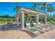 Inviting poolside bar area with seating and lounging, perfect for enjoying refreshments by the pool at 8462 Secret Key Cv, Kissimmee, FL 34747