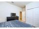 Comfortable bedroom with a dresser, closet and carpet flooring, perfect for relaxation at 8908 Adriatico Ln, Kissimmee, FL 34747