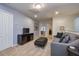 Relaxing bonus room with a grey sofa and neutral carpeting at 8908 Adriatico Ln, Kissimmee, FL 34747