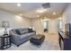 Upstairs bonus room with a comfortable grey sofa at 8908 Adriatico Ln, Kissimmee, FL 34747