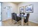 Dining room boasts a glass table with seating for six at 8908 Adriatico Ln, Kissimmee, FL 34747