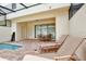 The home features an outdoor brick patio area with a pool at 8908 Adriatico Ln, Kissimmee, FL 34747