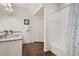 Bright bathroom with granite countertops, a single sink, a closet, and a shower-tub combination for your convenience at 8982 Shine Drive, Kissimmee, FL 34747