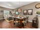 Open concept dining area connected to the living room, featuring stylish decor and a welcoming ambiance at 8982 Shine Drive, Kissimmee, FL 34747