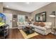 Relaxing living space showcasing modern decor, comfortable sofas, and abundant natural light at 8982 Shine Drive, Kissimmee, FL 34747