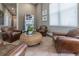 Cozy lounge with leather chairs, a round table, and a vending machine for added convenience at 8982 Shine Drive, Kissimmee, FL 34747
