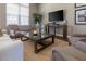 Comfortable lounge with neutral tones, plush seating, and a media center at 8982 Shine Drive, Kissimmee, FL 34747