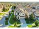 Aerial view of a well-manicured home with mature landscaping, a two-car garage, and a private driveway at 9156 Wedge Dr, Davenport, FL 33896