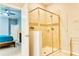 Tiled shower stall with glass door featuring a nice tile accent in the Primary bathroom at 9156 Wedge Dr, Davenport, FL 33896