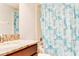 Bright bathroom featuring a granite countertop, a shower and tub combo, and modern fixtures at 9156 Wedge Dr, Davenport, FL 33896